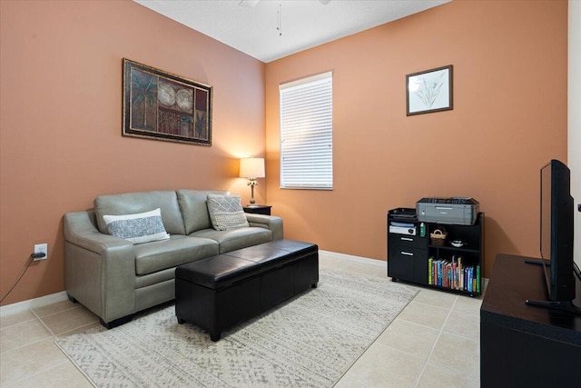 living room featuring light tile patterned floors and ceiling fan