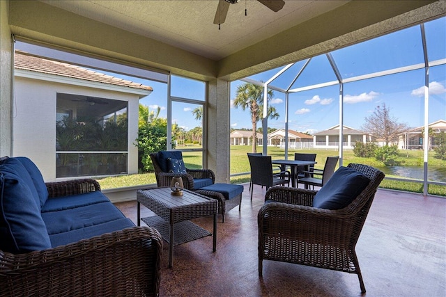 sunroom / solarium featuring ceiling fan