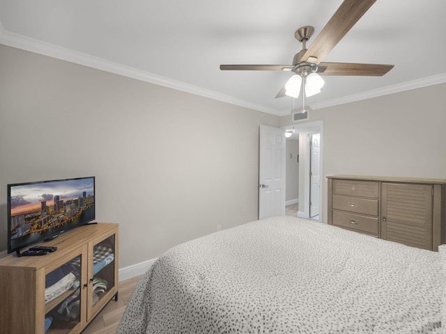 bedroom with crown molding and ceiling fan