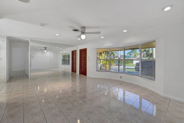 5801 NE 17th Ave, Fort Lauderdale, FL 33334 - spare room featuring light tile patterned flooring, crown molding, a healthy amount of sunlight, and ceiling fan