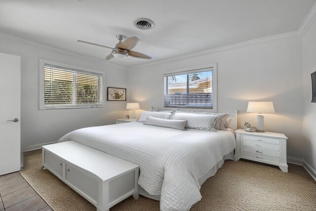 unfurnished room featuring crown molding, ceiling fan, and light tile patterned flooring