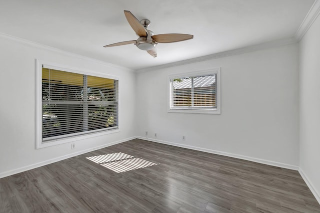 empty room featuring baseboards, ceiling fan, wood finished floors, and crown molding