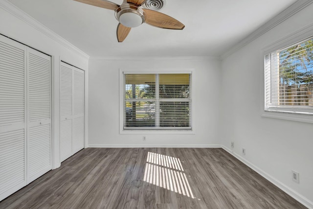 5801 NE 17th Ave, Fort Lauderdale, FL 33334 - unfurnished bedroom featuring ornamental molding, baseboards, a ceiling fan, and wood finished floors