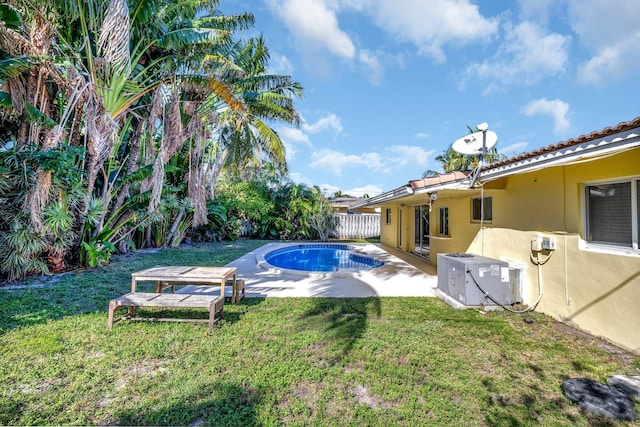 outdoor pool featuring cooling unit, a fenced backyard, a lawn, and a patio