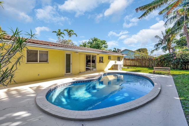 view of swimming pool with a patio area, fence, and a fenced in pool