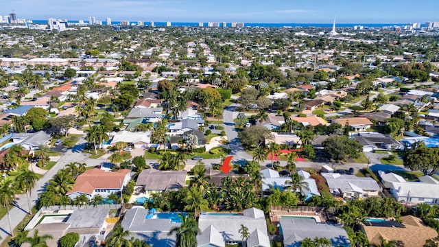 bird's eye view featuring a residential view and a water view