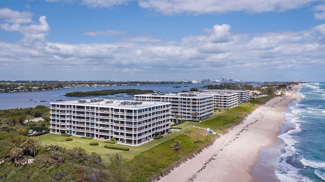 drone / aerial view featuring a water view and a beach view