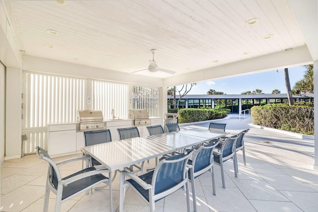 view of patio / terrace featuring exterior kitchen, ceiling fan, and grilling area