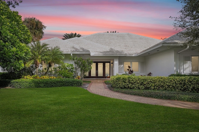 exterior space with a yard and french doors