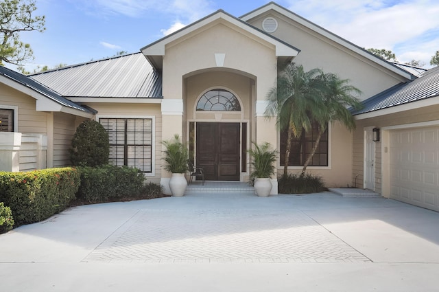 view of exterior entry featuring a garage