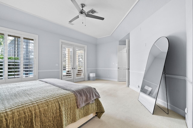 bedroom featuring access to outside, light colored carpet, ceiling fan, and french doors