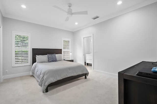 carpeted bedroom with connected bathroom, crown molding, and ceiling fan