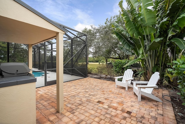 view of patio with glass enclosure