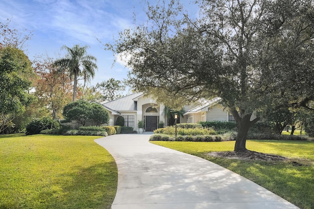 view of front of home with a front lawn