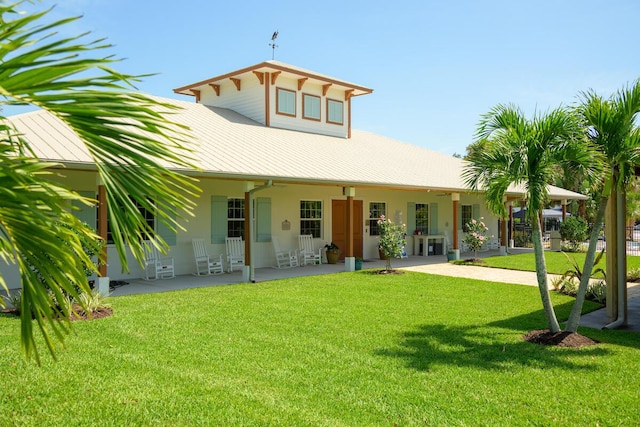 back of property featuring a yard and a patio area