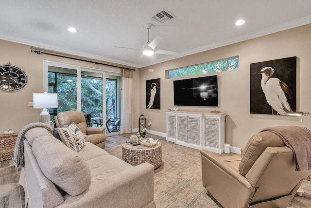 living room featuring crown molding, ceiling fan, and light hardwood / wood-style floors