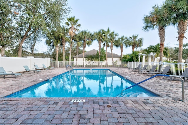 view of swimming pool with a patio area