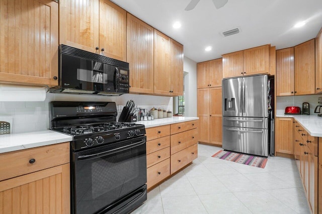 kitchen with tasteful backsplash, ceiling fan, and black appliances