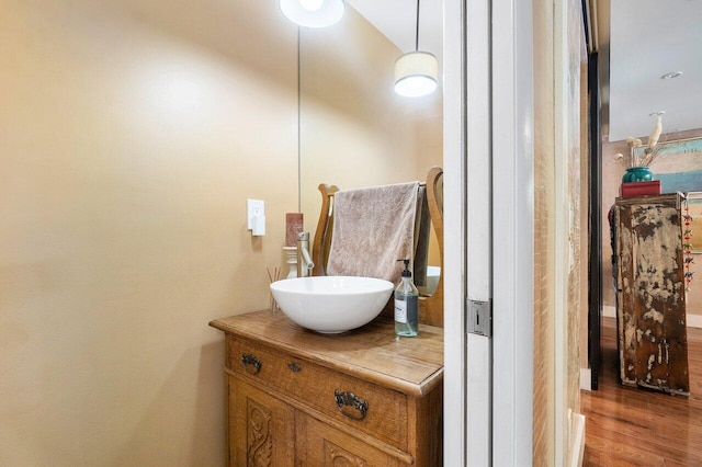 bathroom with vanity and hardwood / wood-style floors