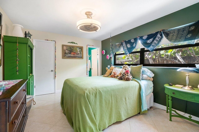 bedroom featuring light tile patterned floors