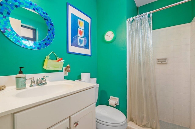 bathroom featuring vanity, a shower with curtain, and toilet