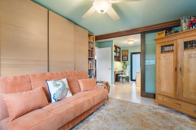 tiled living room with ceiling fan