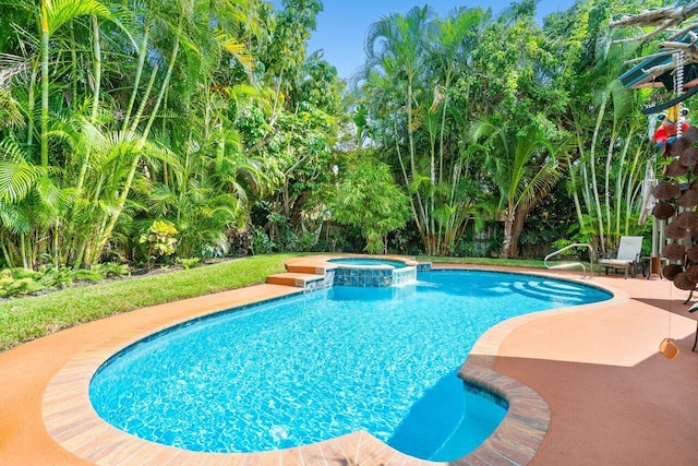 view of pool featuring an in ground hot tub and a patio area