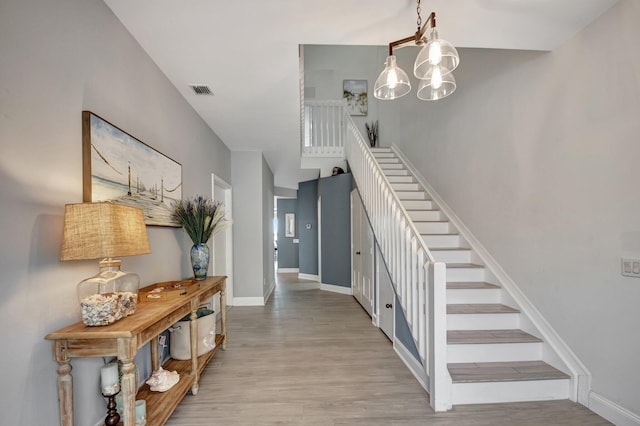 staircase featuring wood-type flooring