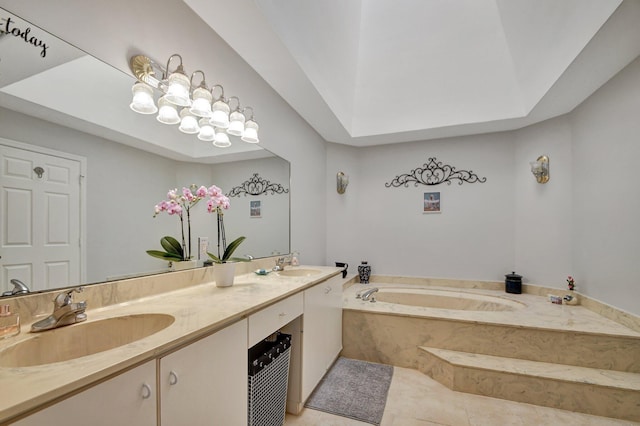 bathroom with a tub to relax in, a tray ceiling, tile patterned flooring, and vanity