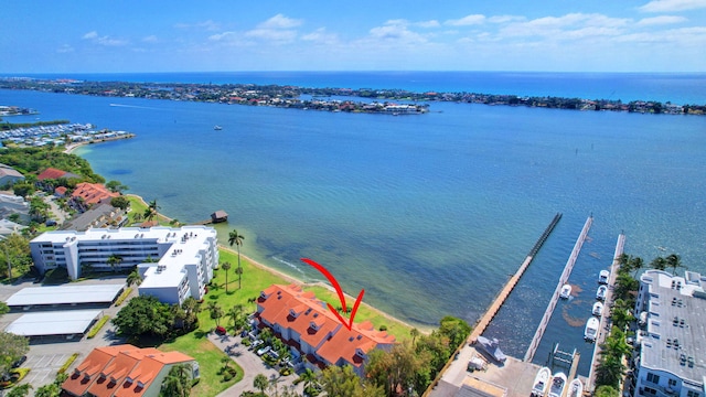 birds eye view of property with a water view