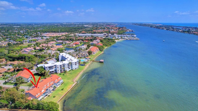 birds eye view of property with a water view