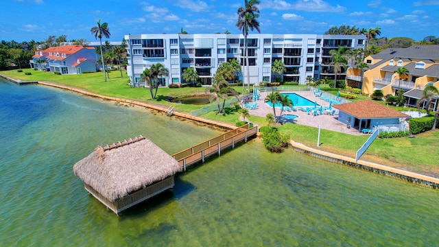 birds eye view of property with a water view