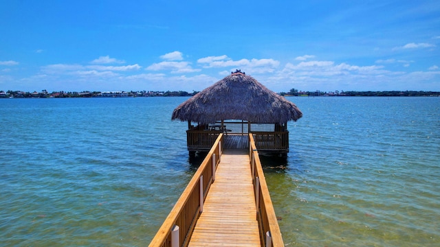 dock area with a gazebo and a water view