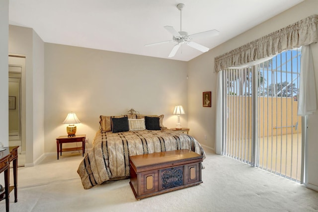 carpeted bedroom featuring access to outside and ceiling fan