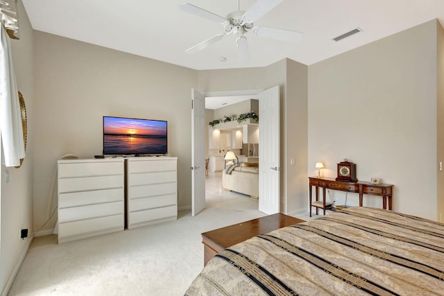 carpeted bedroom featuring ceiling fan