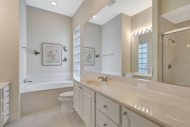 full bathroom with vanity, tile patterned floors, toilet, and separate shower and tub