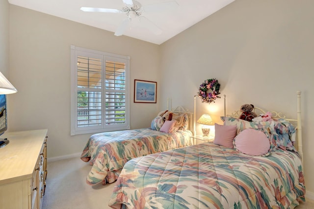 bedroom featuring ceiling fan and light carpet