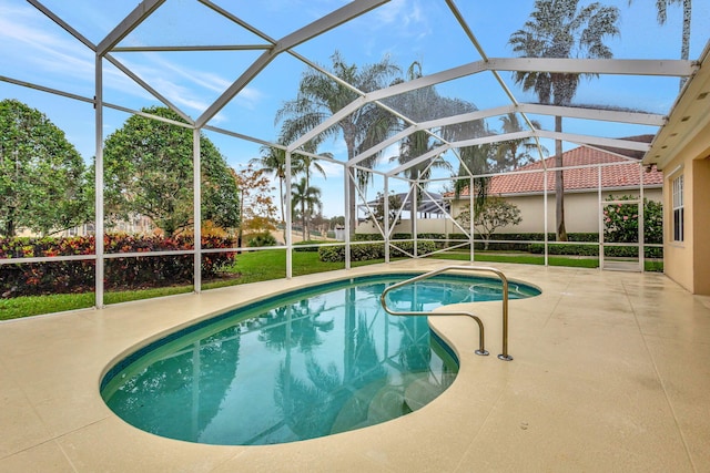 view of pool with a lanai and a patio area