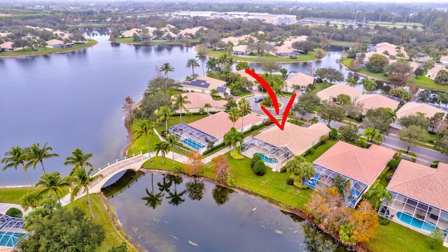 birds eye view of property featuring a water view