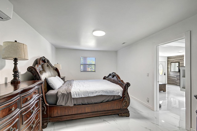 bedroom with connected bathroom and an AC wall unit