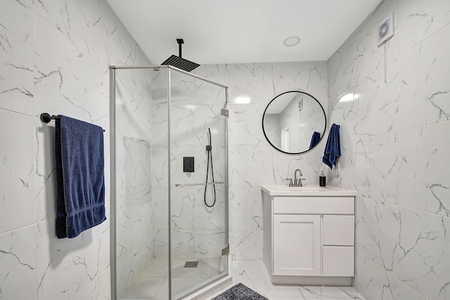 bathroom with an enclosed shower and vanity