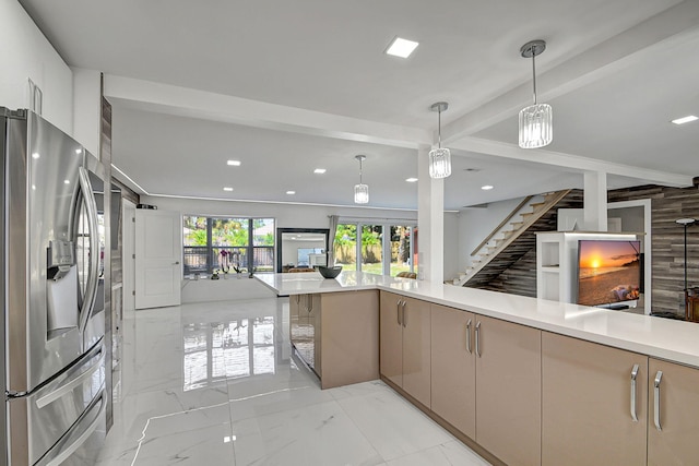 kitchen featuring pendant lighting, beam ceiling, and stainless steel refrigerator with ice dispenser