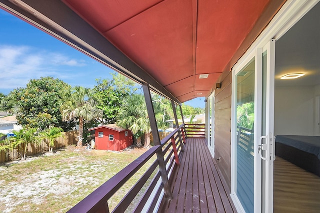 deck featuring a shed