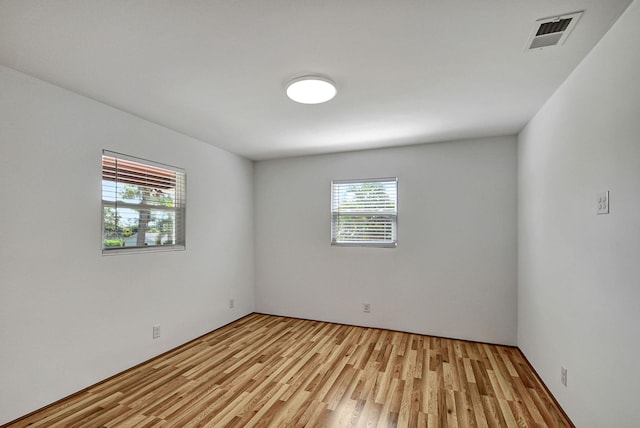 unfurnished room featuring light wood-type flooring