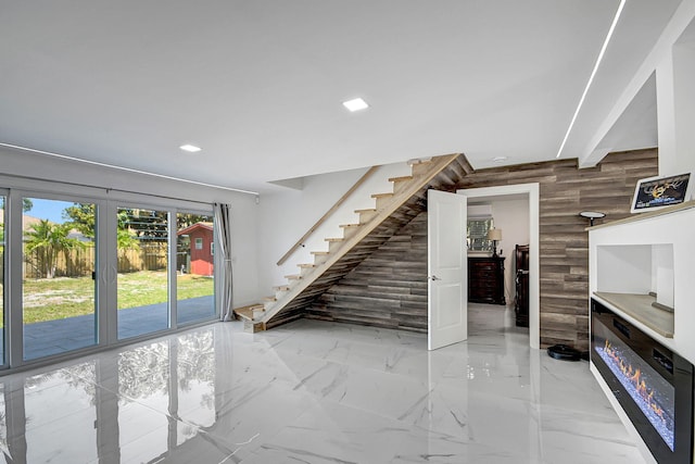 interior space featuring wood walls