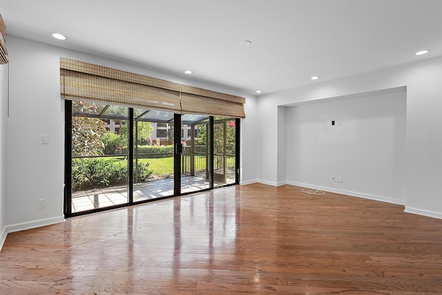 unfurnished room featuring hardwood / wood-style floors