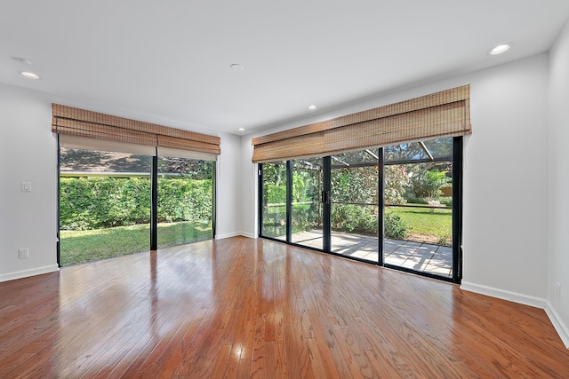 spare room with hardwood / wood-style flooring