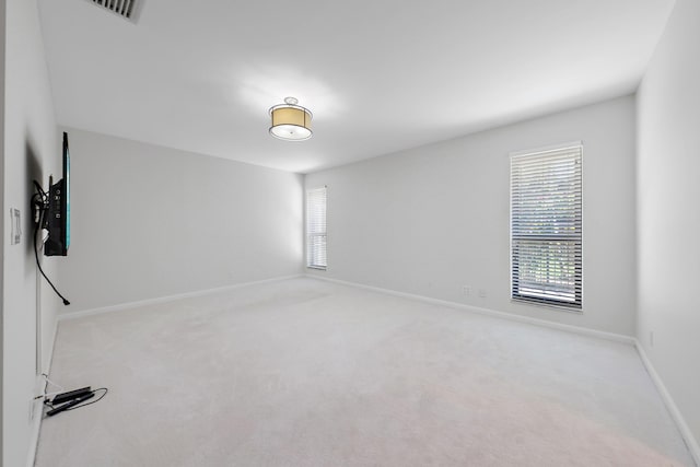 empty room featuring light carpet