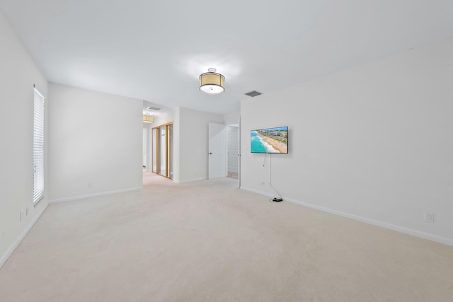 carpeted empty room featuring a healthy amount of sunlight