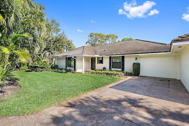 view of front facade with a garage and a front yard